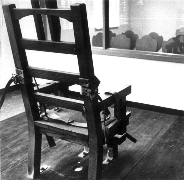 Electric Chair in front of viewing box for witnesses