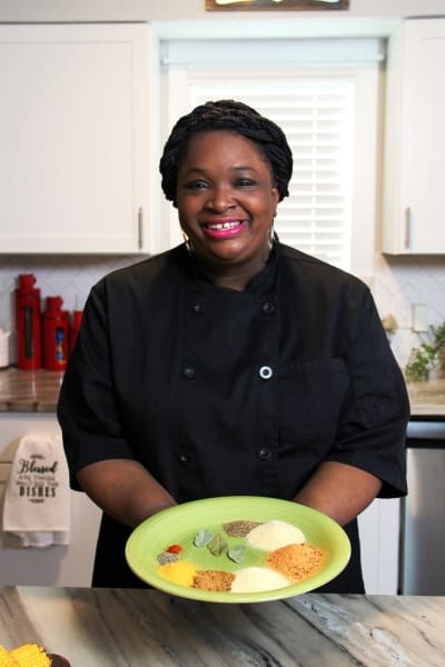 A person sitting at a table with a plate of food