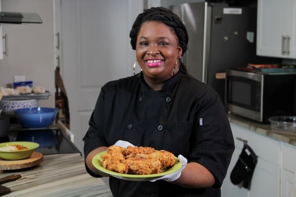 A person standing in front of a plate of food