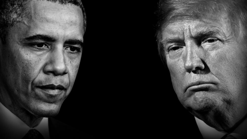 Black and white photo of Obama and Trump's faces.
