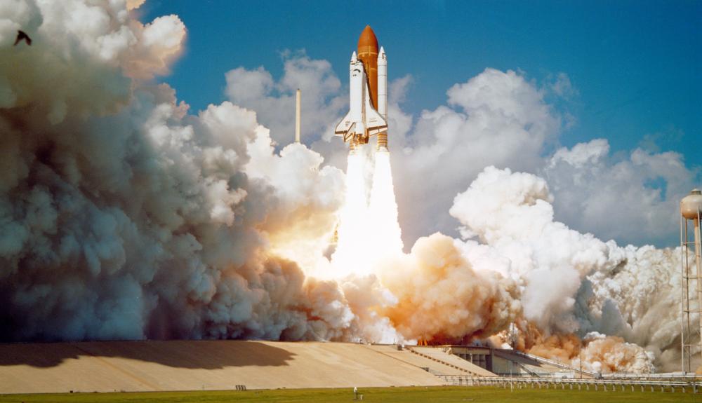 Space shuttle challenger blasting off