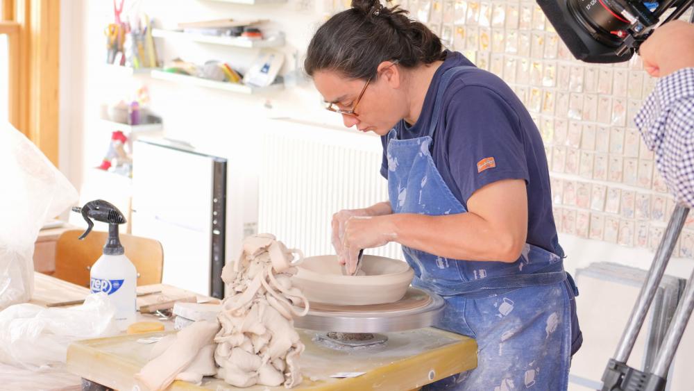 woman looking down using clay image