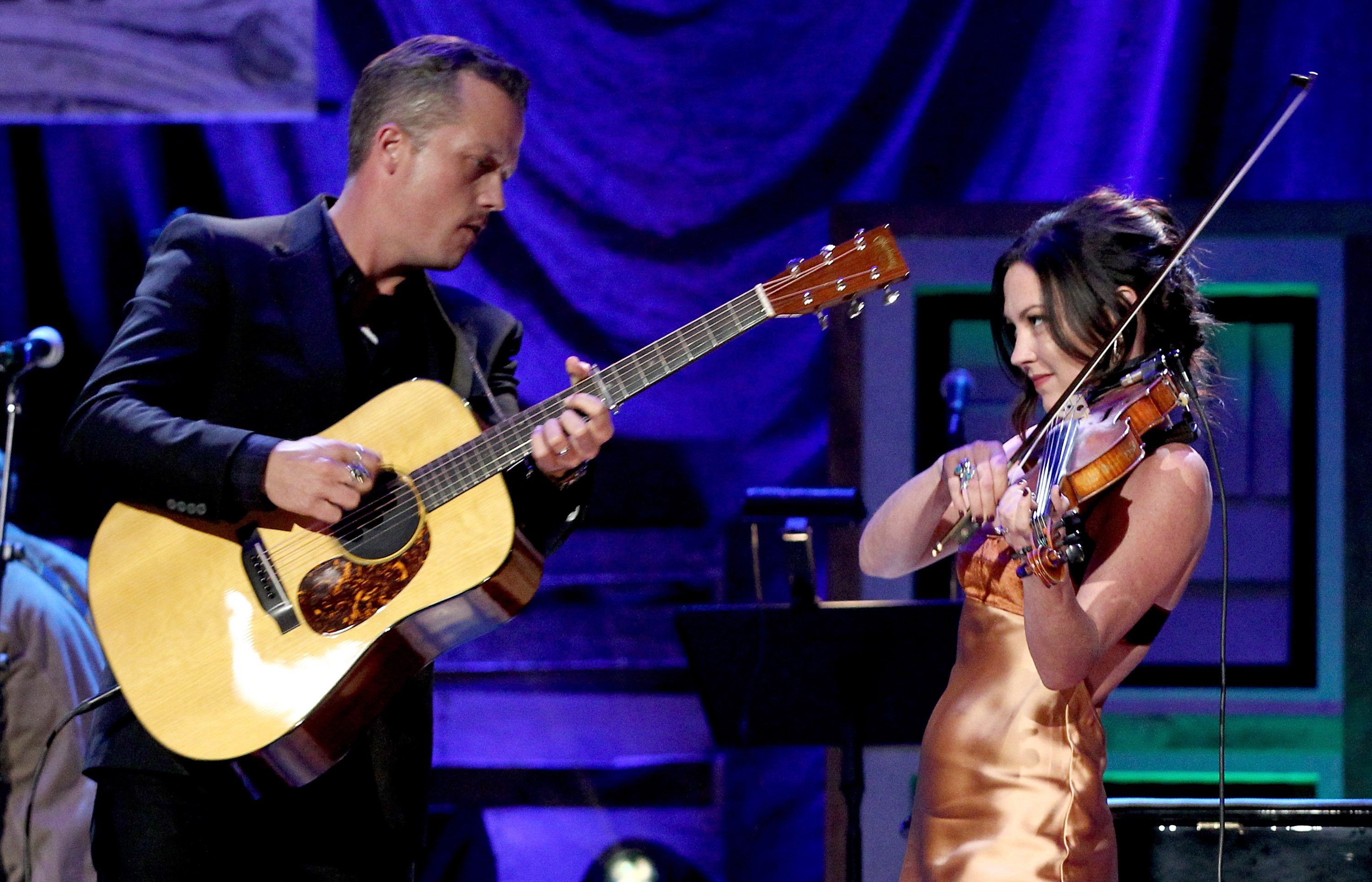 Jason with guitar and Amanda with violin performing