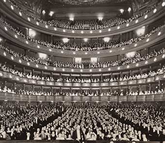 view of the packed audience from the stage of the opera house