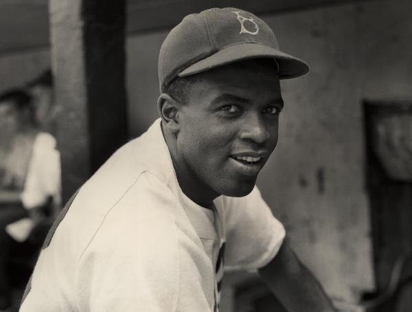 Black and white image of Jackie Robinson in his baseball uniform. image