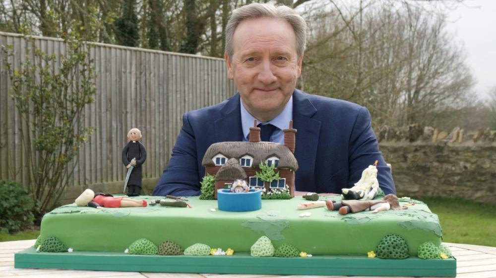 man with a cake image
