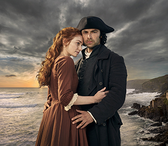 poldark standing with woman in front of water