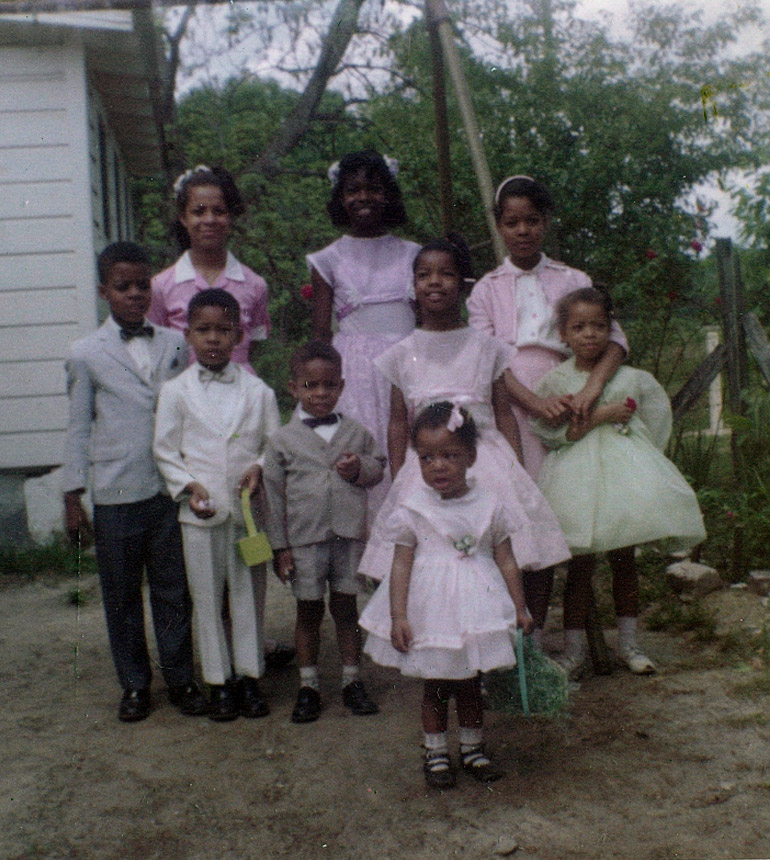 A group of 9 children posing for a picture