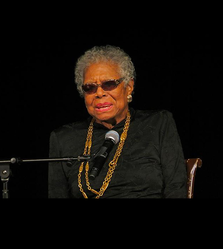 Maya Angelou in front of a microphone