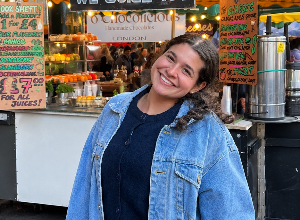 Photo of WFSU's new intern at an outdoor Market