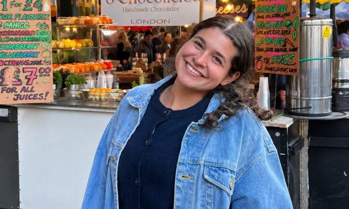 Photo of WFSU's new intern at an outdoor Market