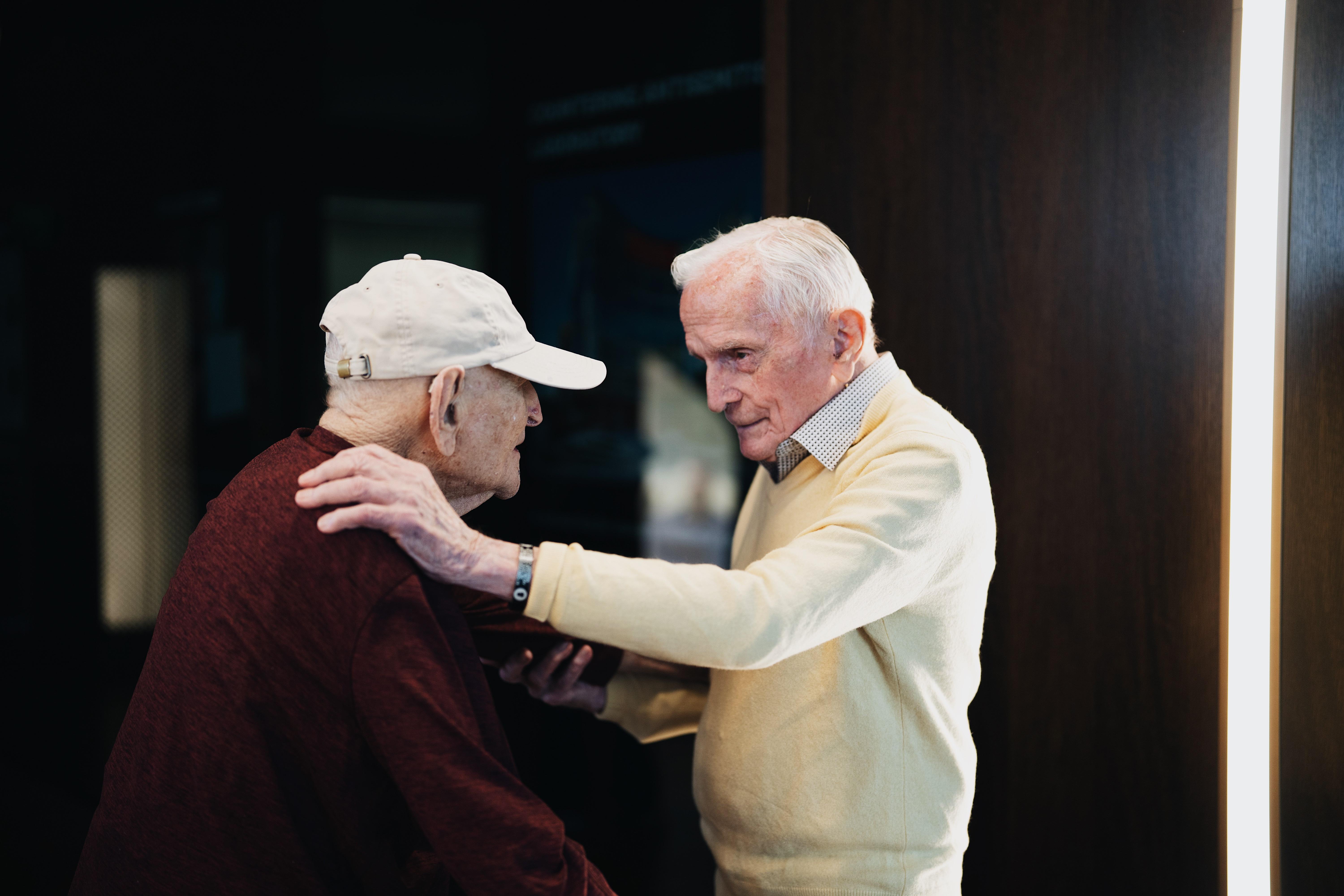 Andrew Roth (left) stands up from his wheelchair to give Jack Moran a hug at the Shoah Foundation at the University of Southern California in Los Angeles. Roth was imprisoned in the Buchenwald concentration camp, which Moran helped liberate while serving in the U.S. Army.<br><br><br><br>