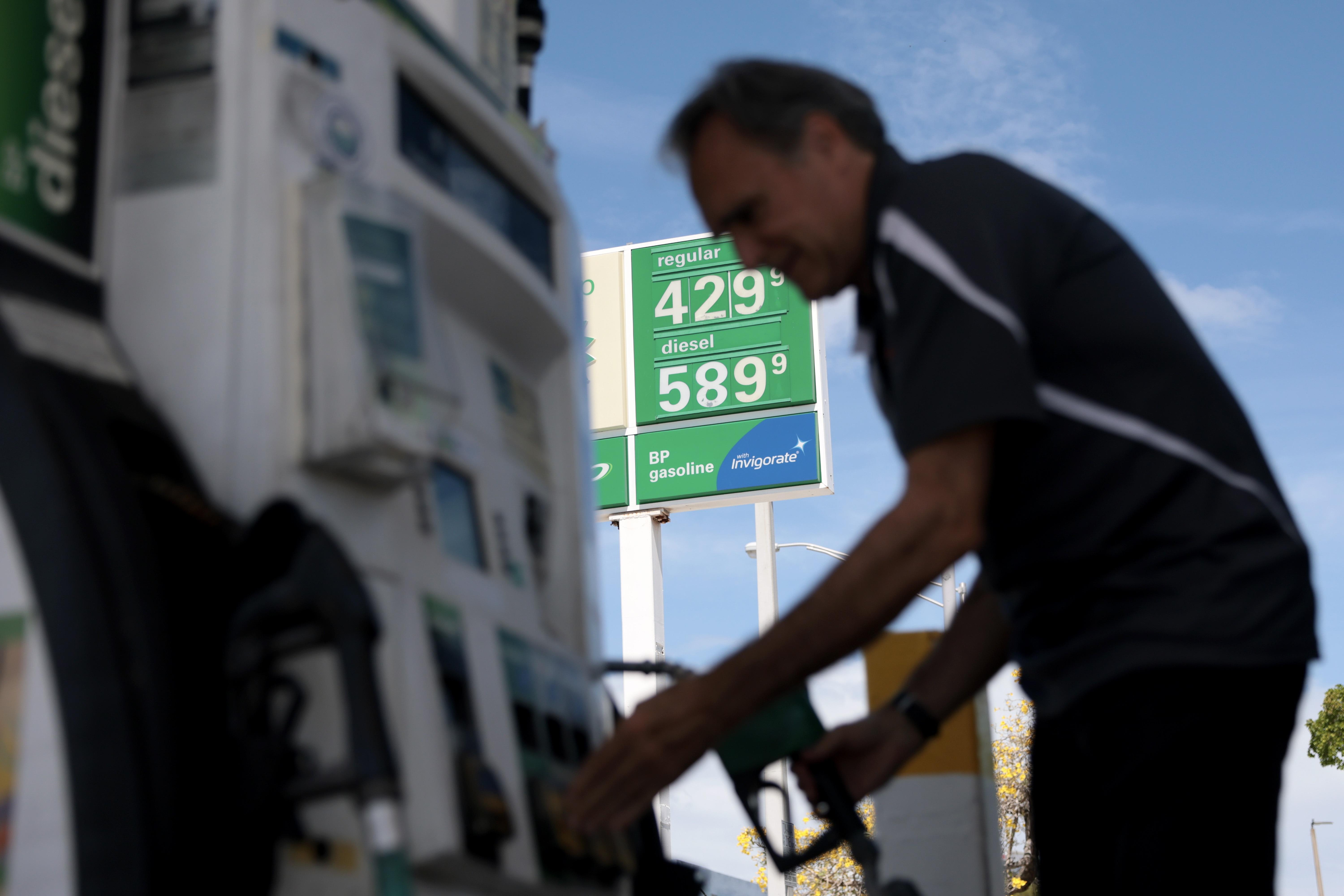 Carlos Ferre puts fuel in his vehicle at a gas station in Miami on April 6. Florida gas prices have risen to over $4 per gallon as of early April as the war in Iran has affected global oil supplies, leading to higher crude oil costs.