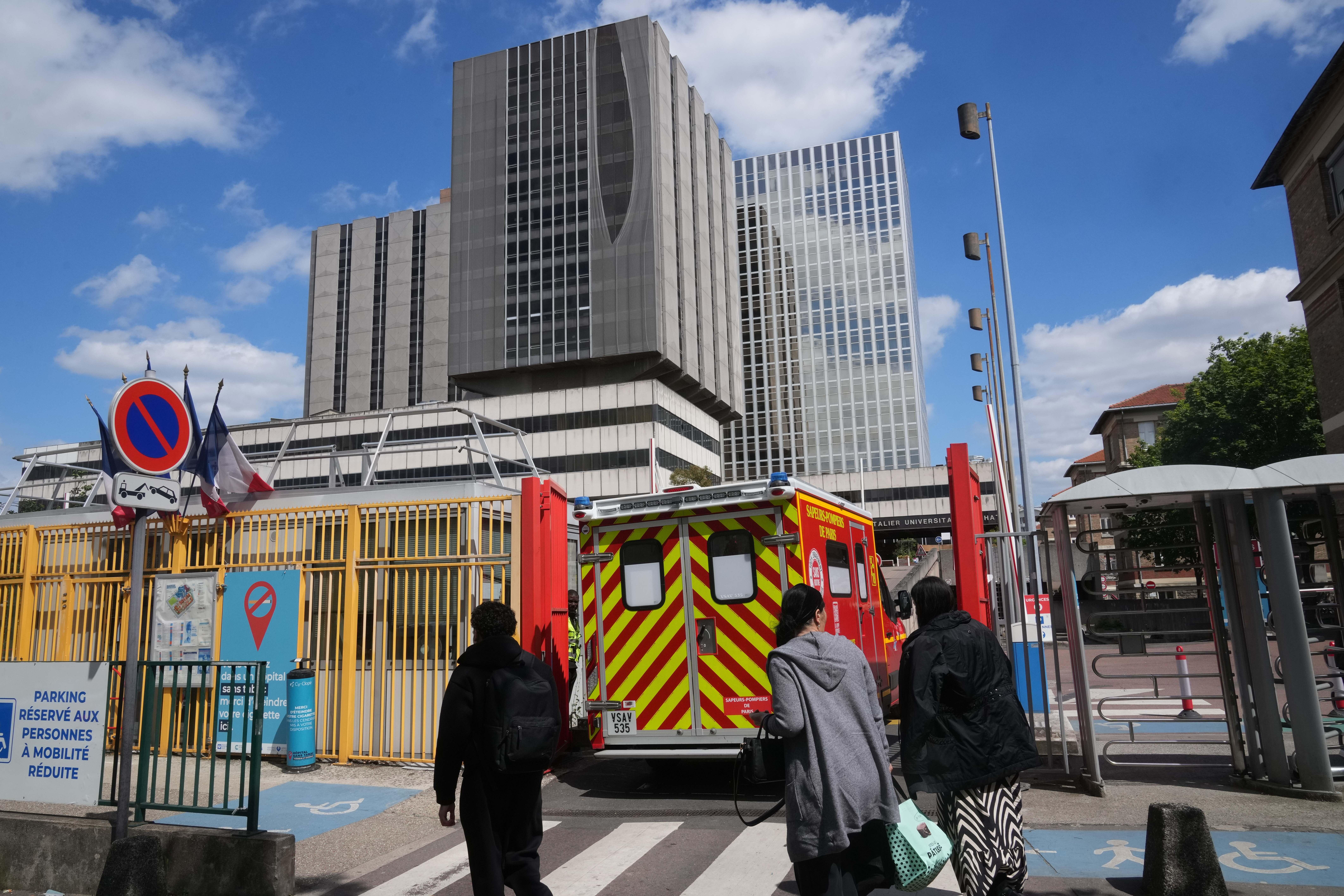An ambulance enters the Bichat Hospital where a woman who tested positive for hantavirus remains in intensive care, in Paris, Tuesday, May 12, 2026.