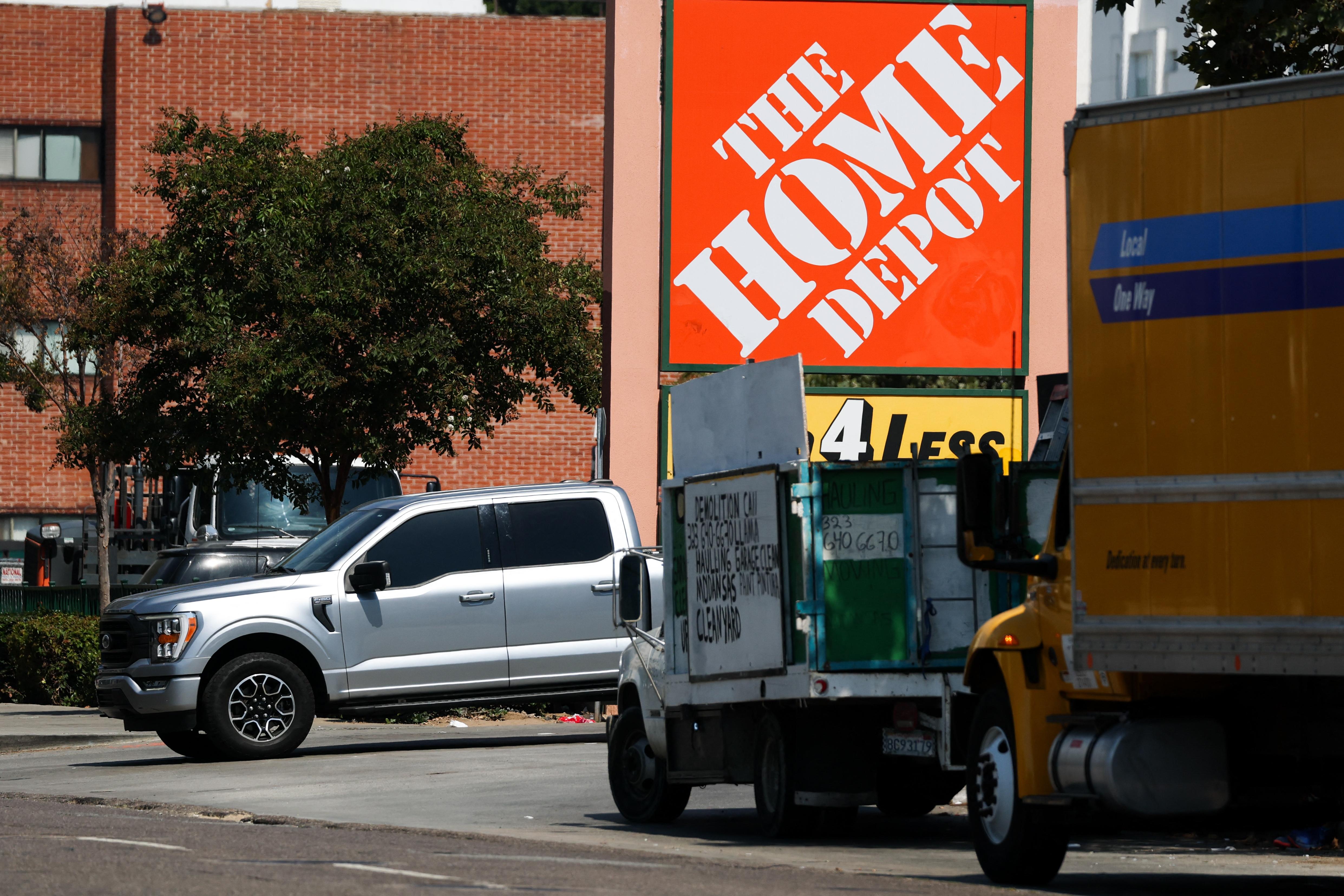 The Home Depot logo is displayed outside a store in Los Angeles where immigration agents arrested day laborers after jumping out of a rental moving truck.