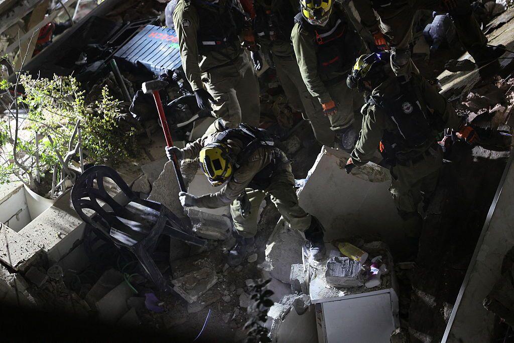 Israeli search and rescue personnel work at the site of a residential building destroyed in an Iranian strike in the northern city of Haifa on Sunday.