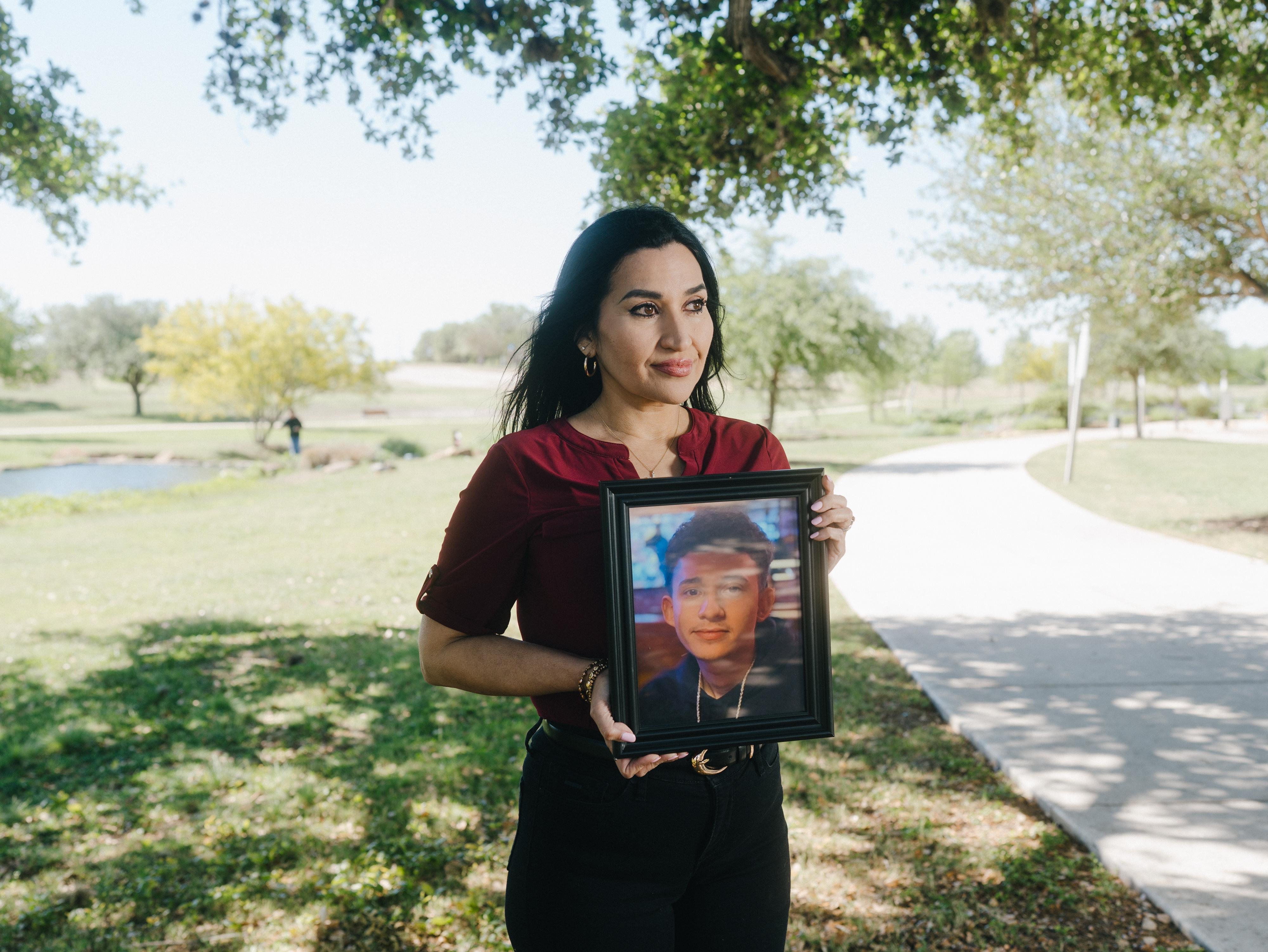 Rachel Reyes, holds a photo of her son, Ruben Ray Martinez, a U.S. citizen who was shot and killed by an Immigration and Customs Enforcement agent during a traffic encounter in Texas.