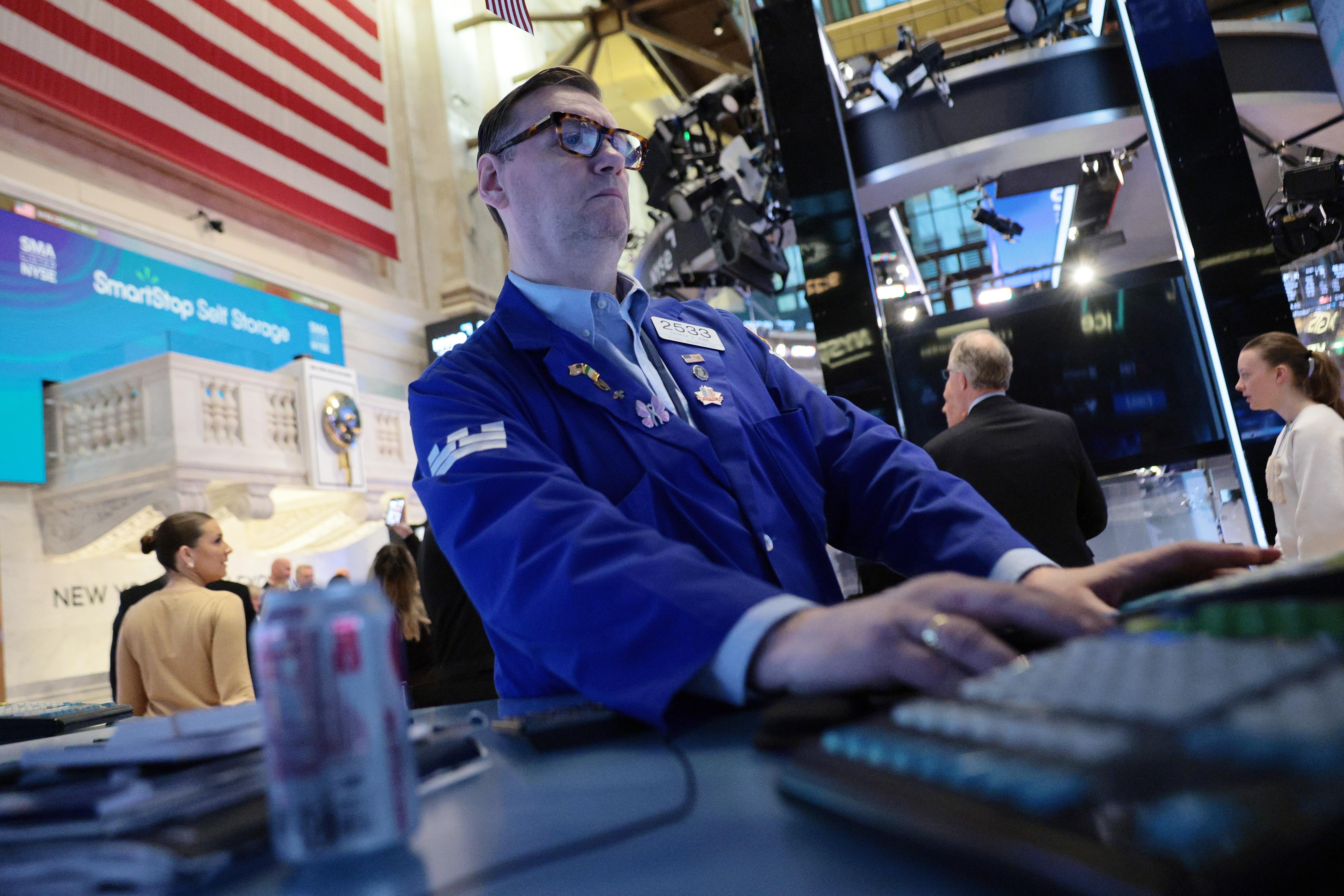 Traders work on the floor of the New York Stock Exchange during morning trading last week in New York City.