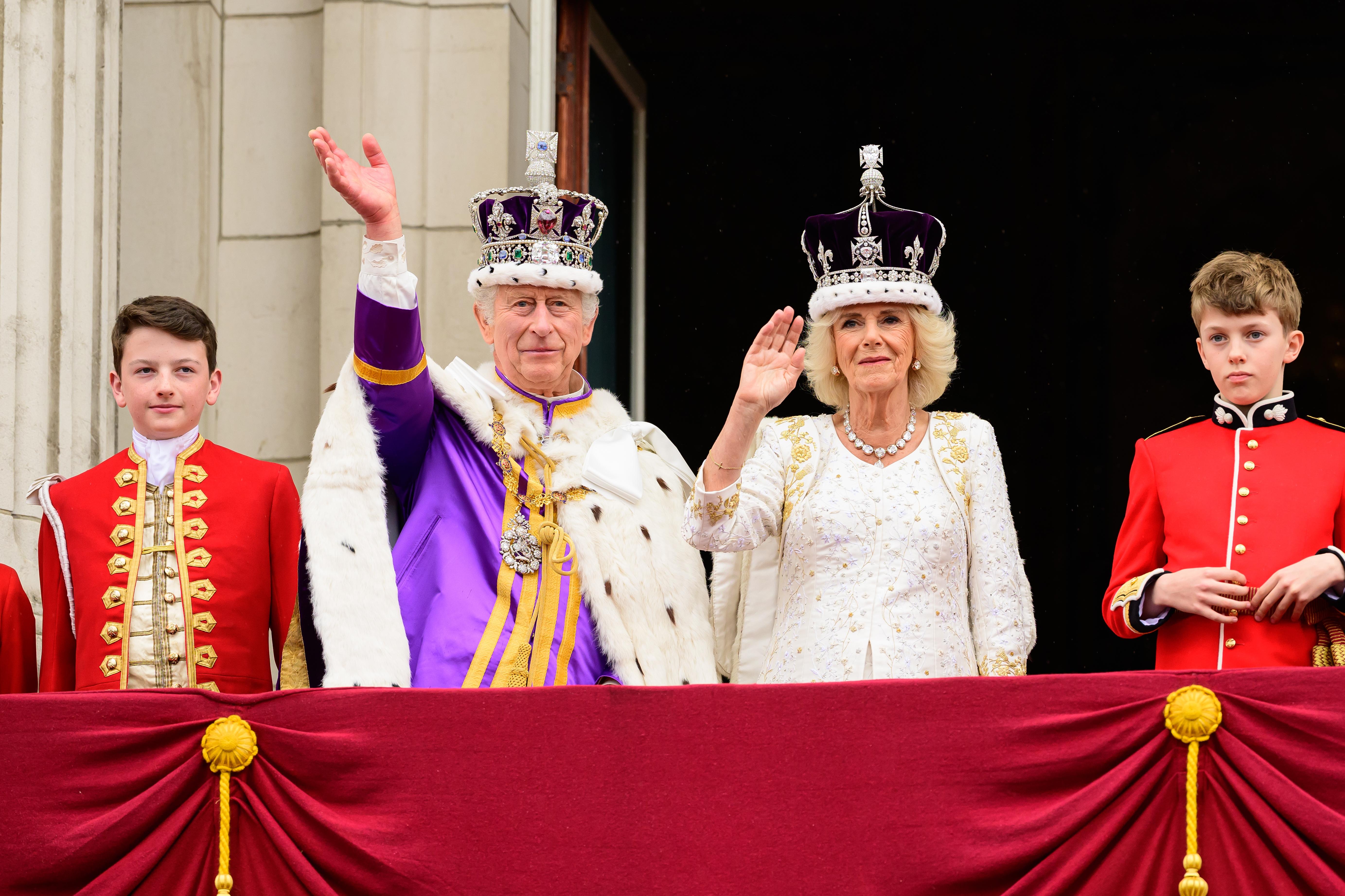 King Charles III and Queen Camilla wave from the balcony of Buckingham Palace during the Coronation of King Charles IIII and Queen Camilla on May 06, 2023 in London, England.