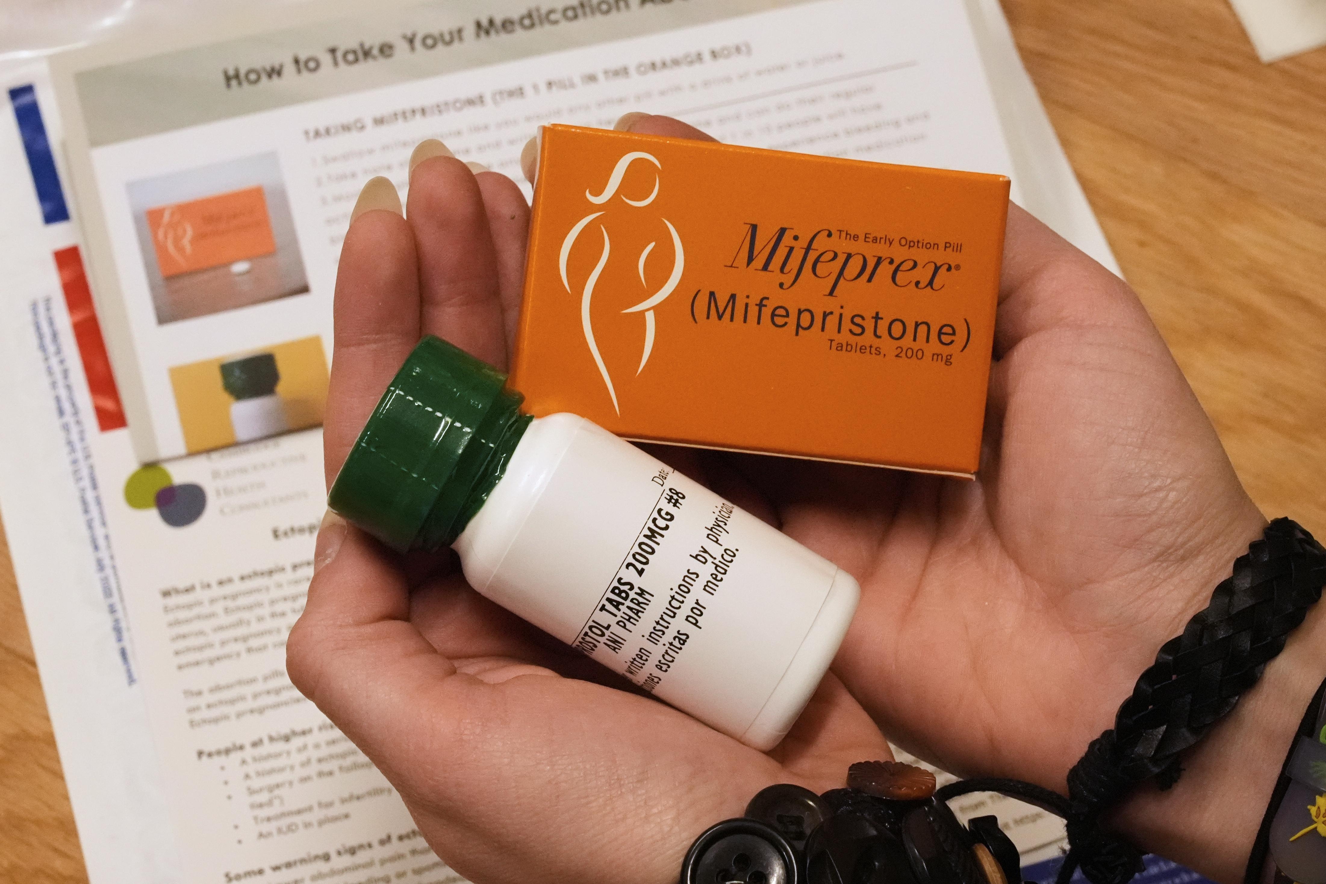 A coordinator at Massachusetts Medication Abortion Access Project shows what the medication abortion kit that is prescribed and mailed via telehealth looks like.