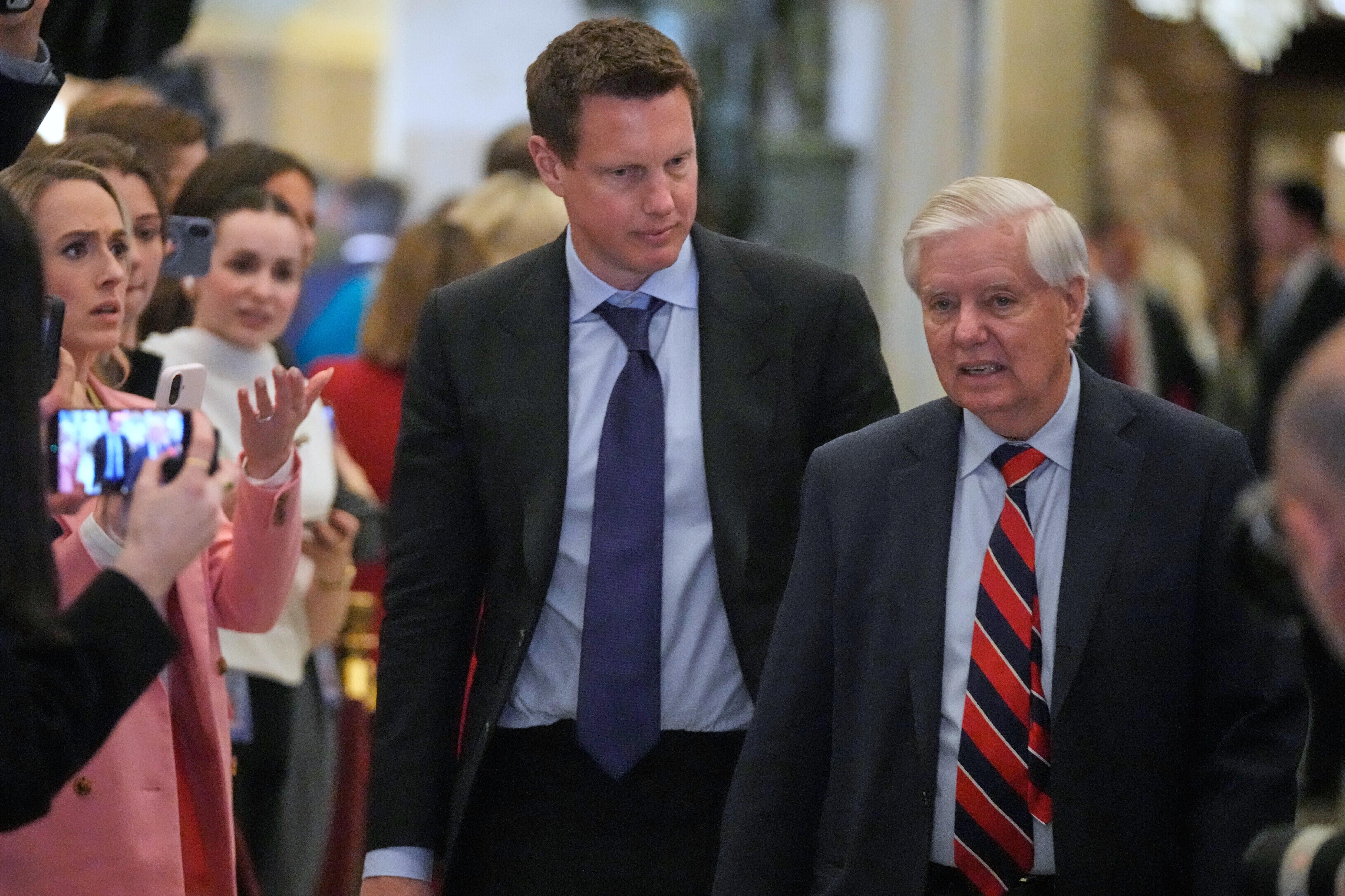Paramount CEO David Ellison arrives with Sen. Lindsey Graham, R-S.C., before President Donald Trump delivers the State of the Union  in the House chamber at the U.S. Capitol in Washington, Tuesday, Feb. 24, 2026.