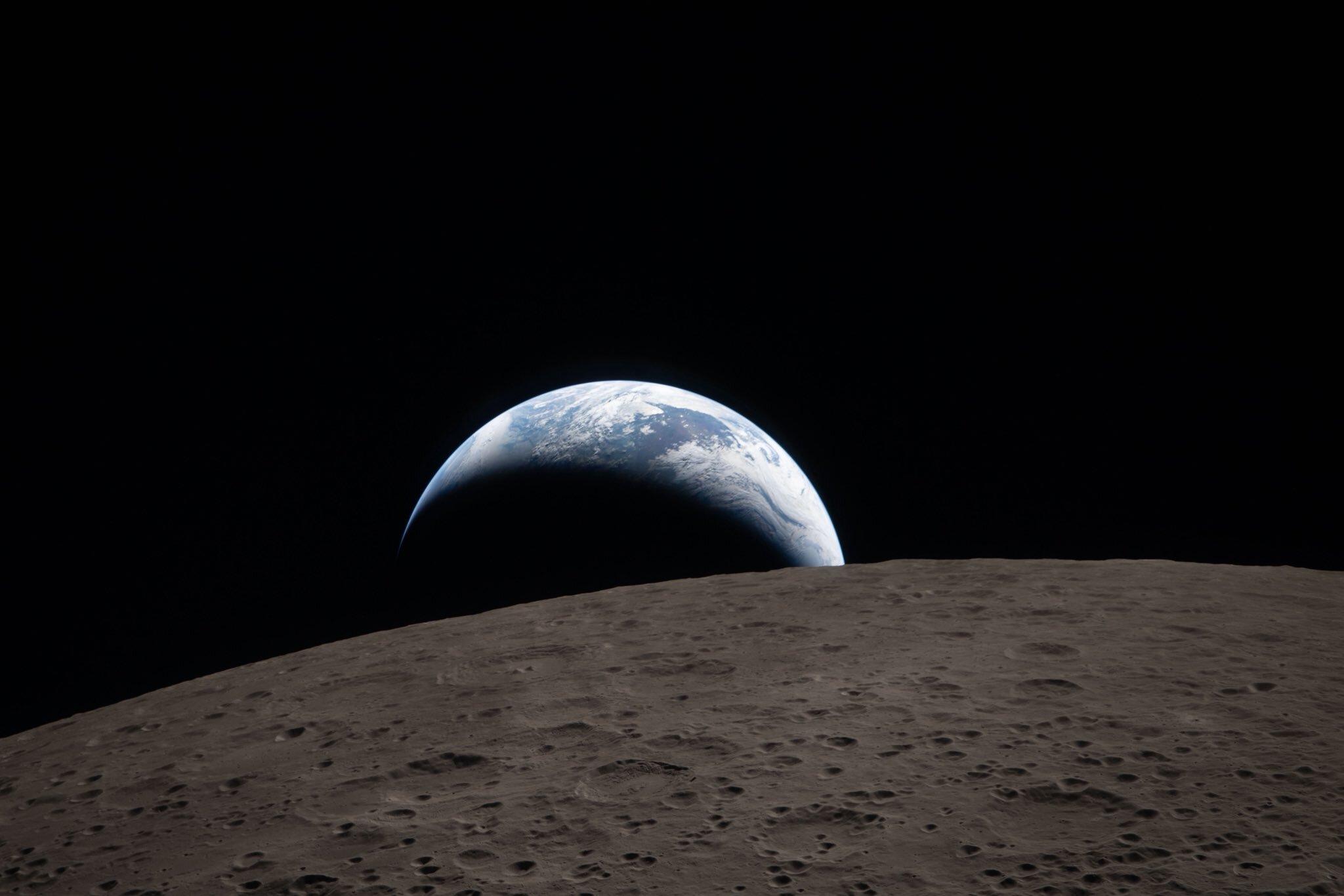 Earthset captured through the Orion spacecraft window at 6:41 p.m. ET on April 6 during the Artemis II crew