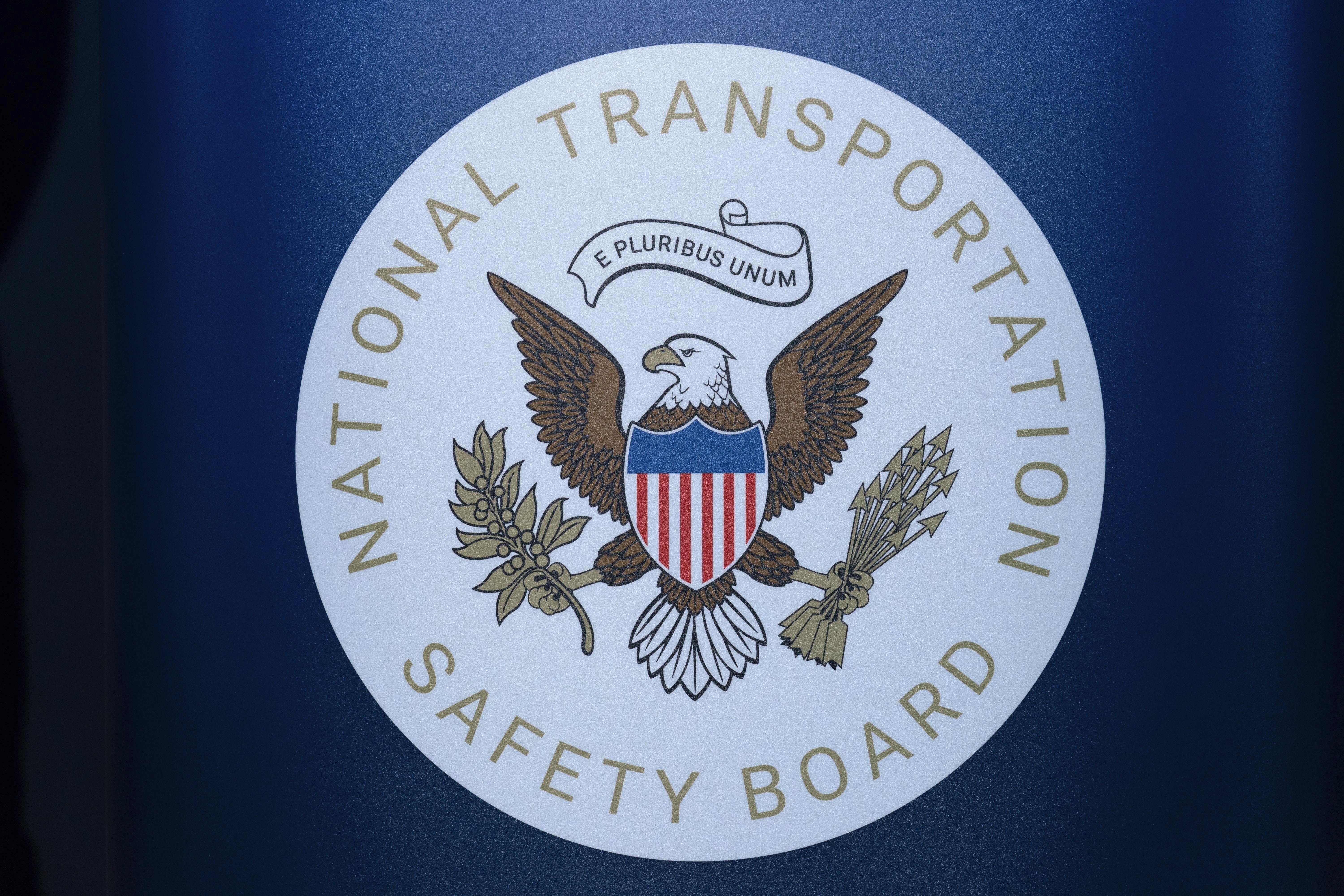The seal of the National Transportation Safety Board is seen before a news conference at Ronald Reagan Washington National Airport on Jan. 31. The pilot of a small plane that crashed near a North Carolina airport this month had raised a wheel after landing to avoid hitting a turtle on the runway, according to a preliminary report by the NTSB.