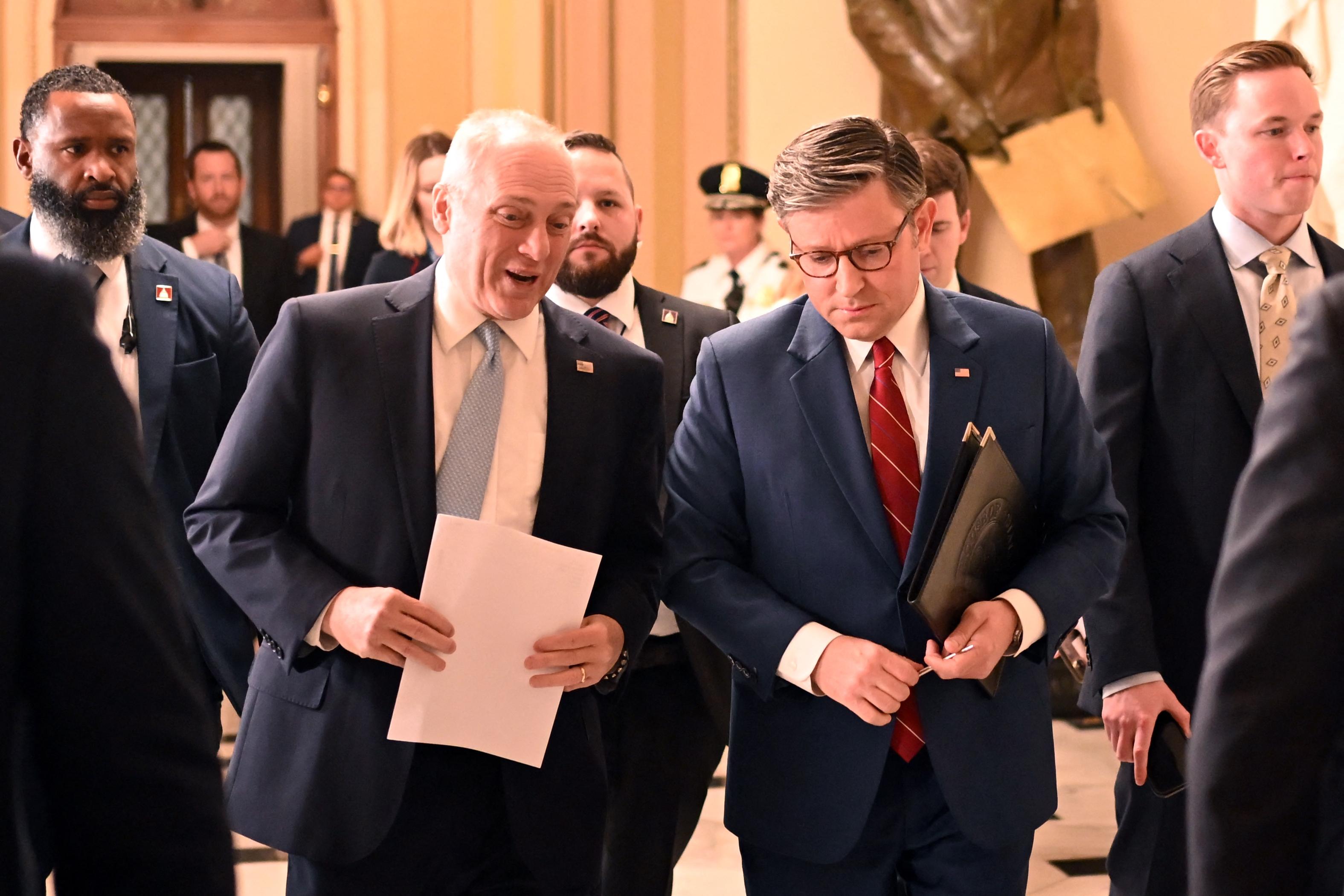Speaker of the House Mike Johnson (R) and House Majority Leader Steve Scalise chat while on their way to talk with reporters after the vote to re-open the government on Nov. 12. Johnson sent members home after they voted on a continuing resolution to fund the government in mid-September.