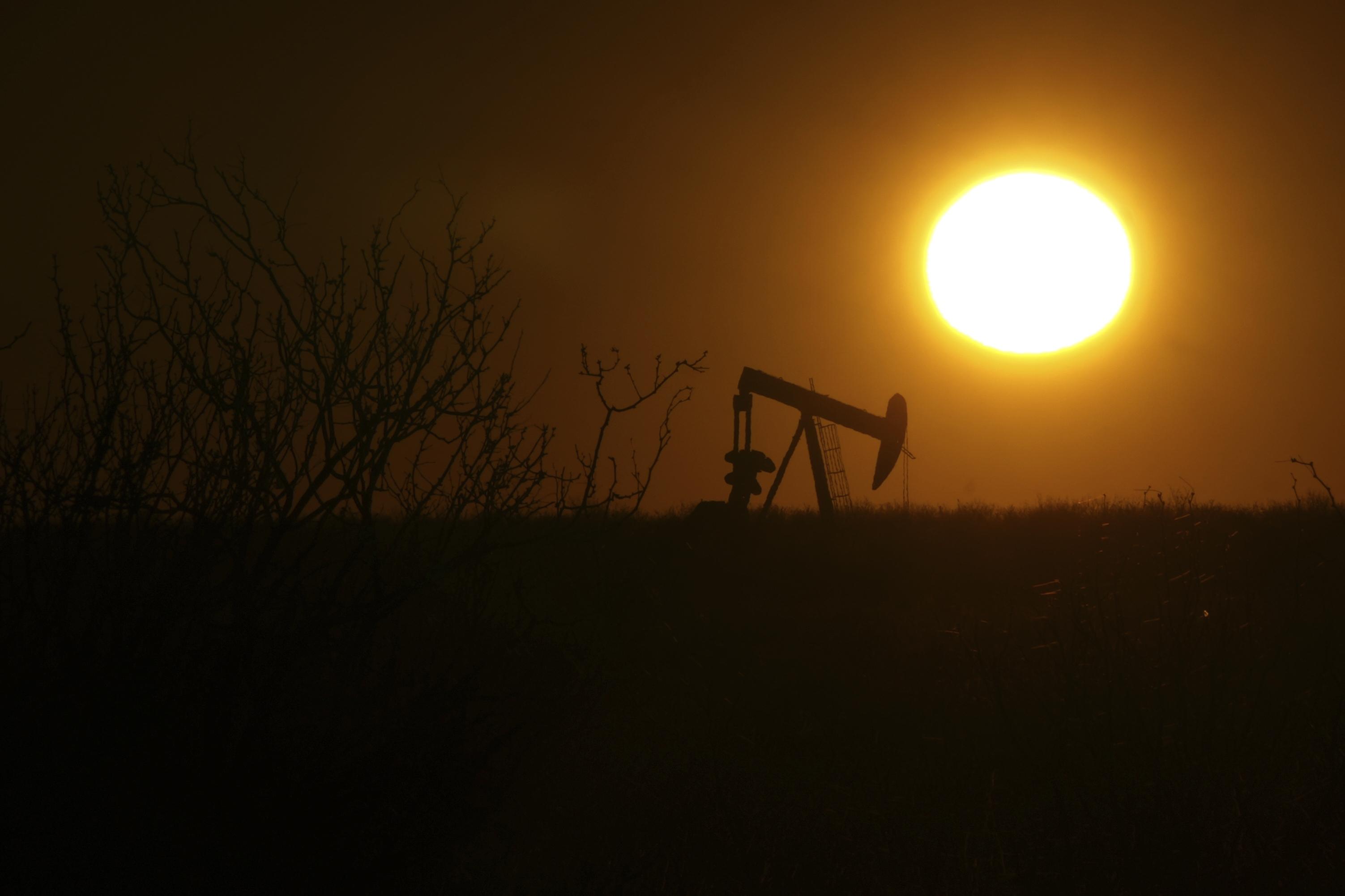 A pumping jack is visible at sunrise on Feb. 24, 2025, in Hobbs, New Mexico.