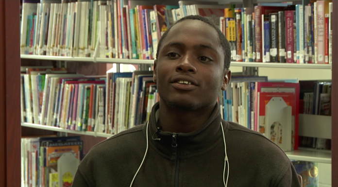 Meet Success Academy Seniors Johnny, Alyssa, and James Johnny Davis in the library.