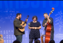 The New 76ers Perform a New Song at Gradstock. People on stage with instruments