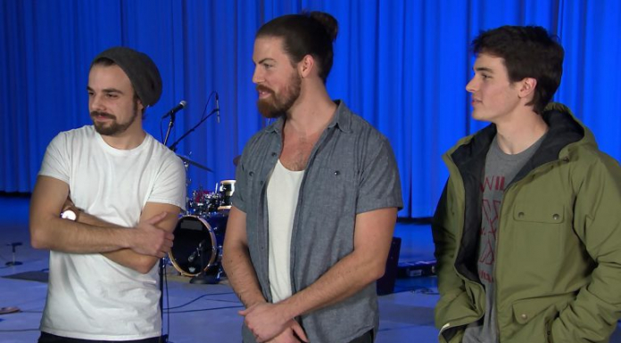 The Musical Journey of Taller Trees Three musicians stand on stage