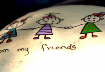 Tallahassee Rocks A New Hide & Seek Art Activity Rock with painted children holding hands