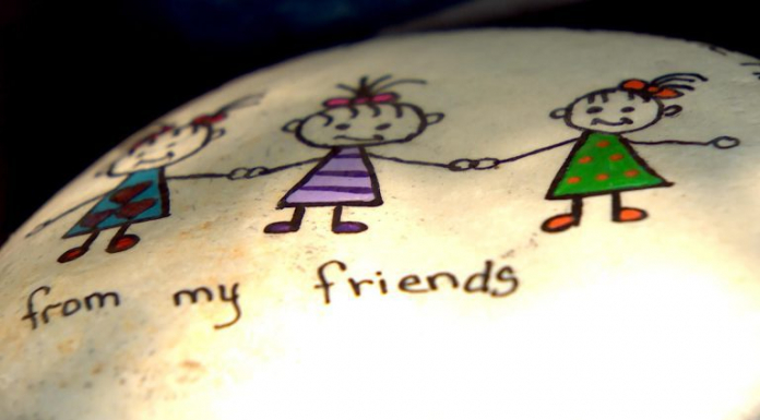 Tallahassee Rocks A New Hide & Seek Art Activity Rock with painted children holding hands