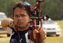 The William Tell of Cairo, GA Person prepares to shoot bow and arrow