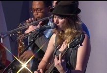 Rachel Hillman sings “The Times They Are A Changin’” Rachel Hillman sings on stage while musician plays trumpet