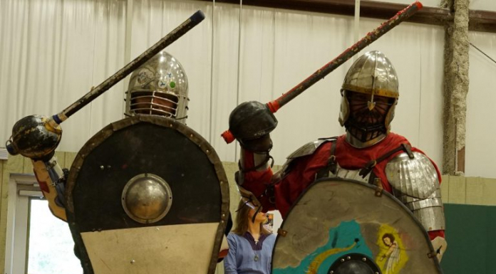 Local Routes – Episode 401 Two men dressed in medieval armor holds swords and shields