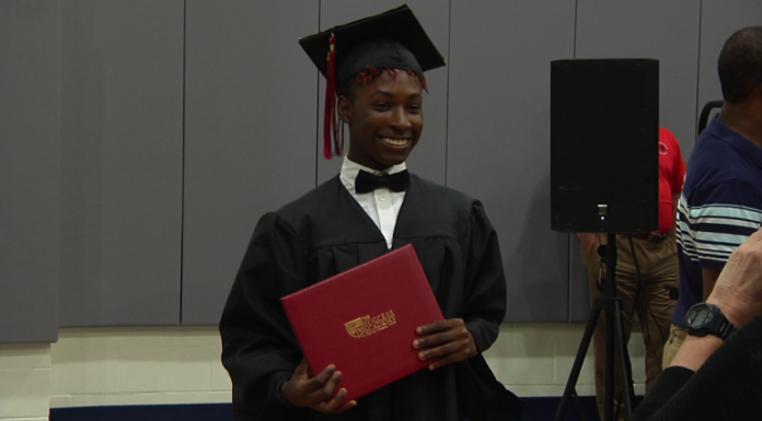 Local Routes – Episode 403 Recent graduate smiles and holds diploma