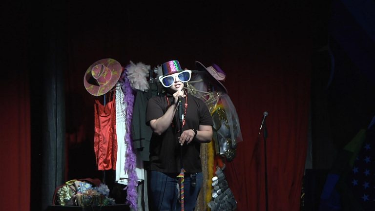 Celebrating Art & Culture with First Fridays Actor preforms on stage