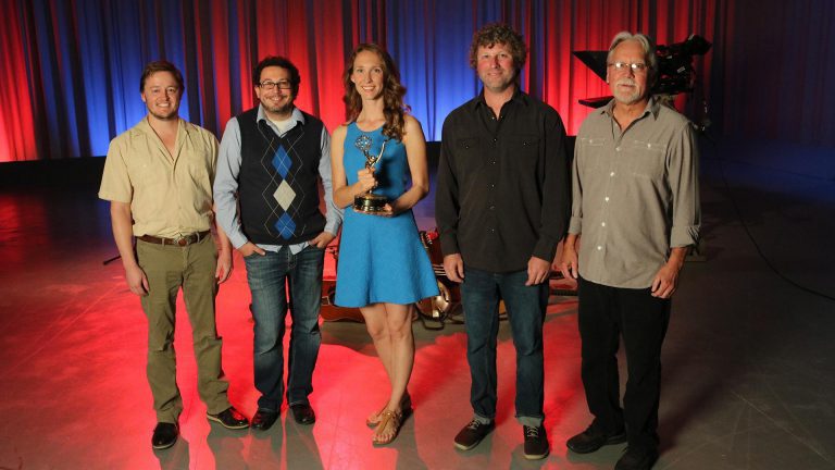 Making Music and Memories with Belle and The Band Band stands on stage