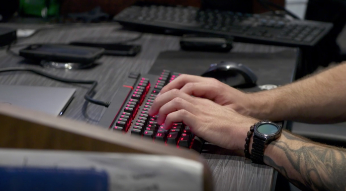 Apprenticeships Allow You to Learn & Earn on Your Way to a New Career hands typing on black backlit keyboard