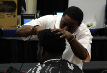 Exploring the 2019 Leon Works Expo Barber shaves a mans head