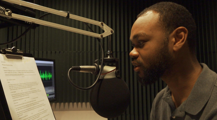 How WFSU Prepares for a Hurricane Man on radio talk show talks into microphone to inform listeners on how to prepare for approaching storm