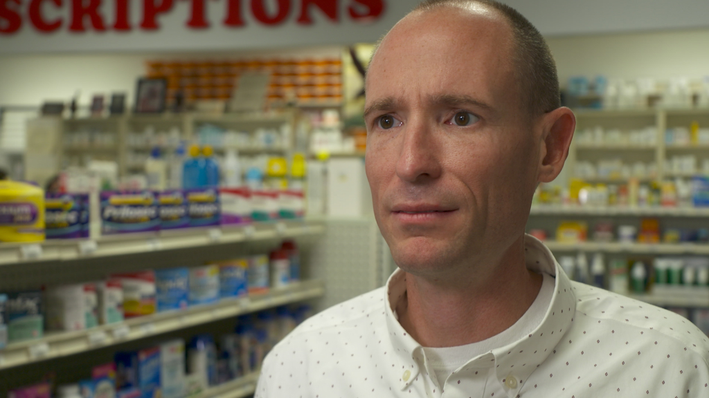 Pharmacist Jon Plummer inside his drugstore.