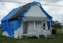 Preserving The Heart of Callaway After Hurricane Michael A person standing in front of a house