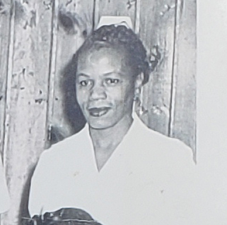 A black and white photo of a nurse