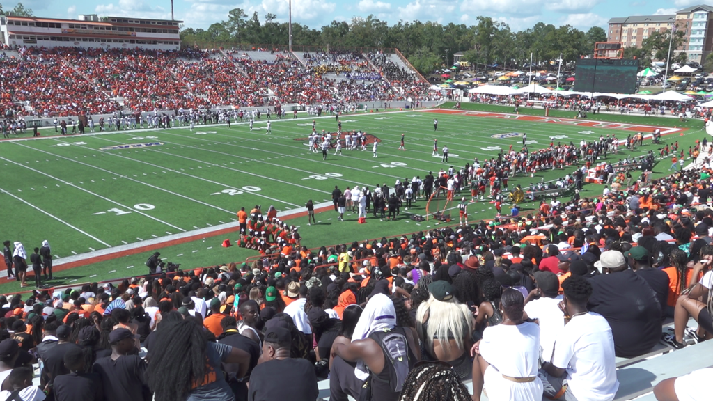 A large crowd of people at football stadium.