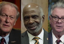 Local College Presidents talk Post – Secondary Attainment John E. Thrasher wearing a suit and tie