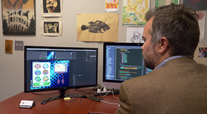 American Graduate: Application Developer A man sitting front of a computer