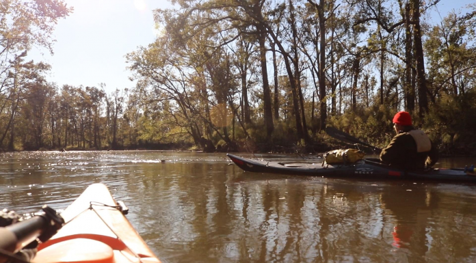 Chipola River Paddling Trail A man sitting in a boat on a body of water